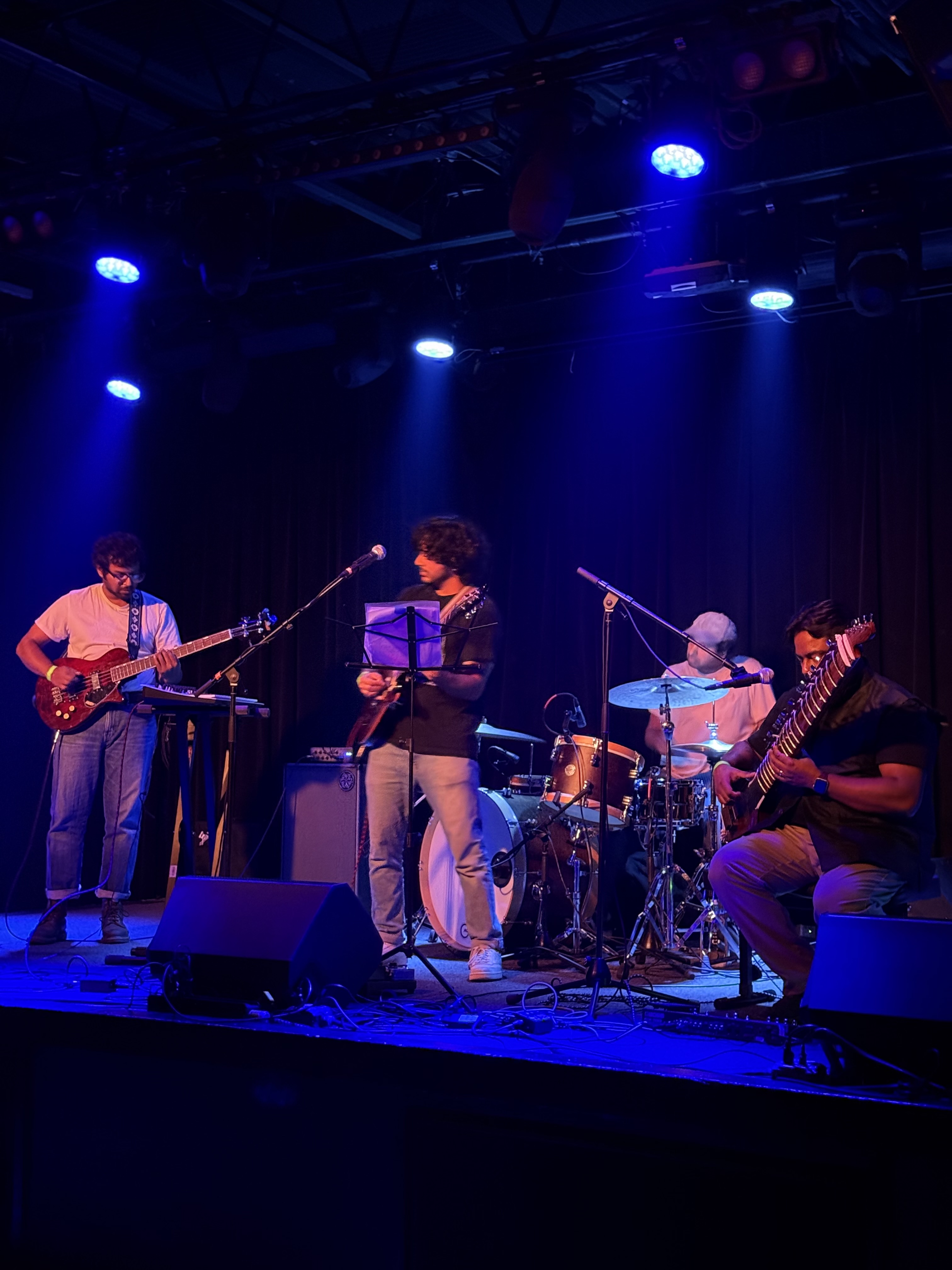 Laal Taal performing on stage under blue lights
